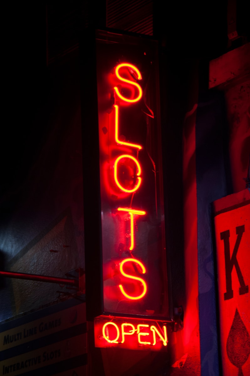 red and white love neon light signage